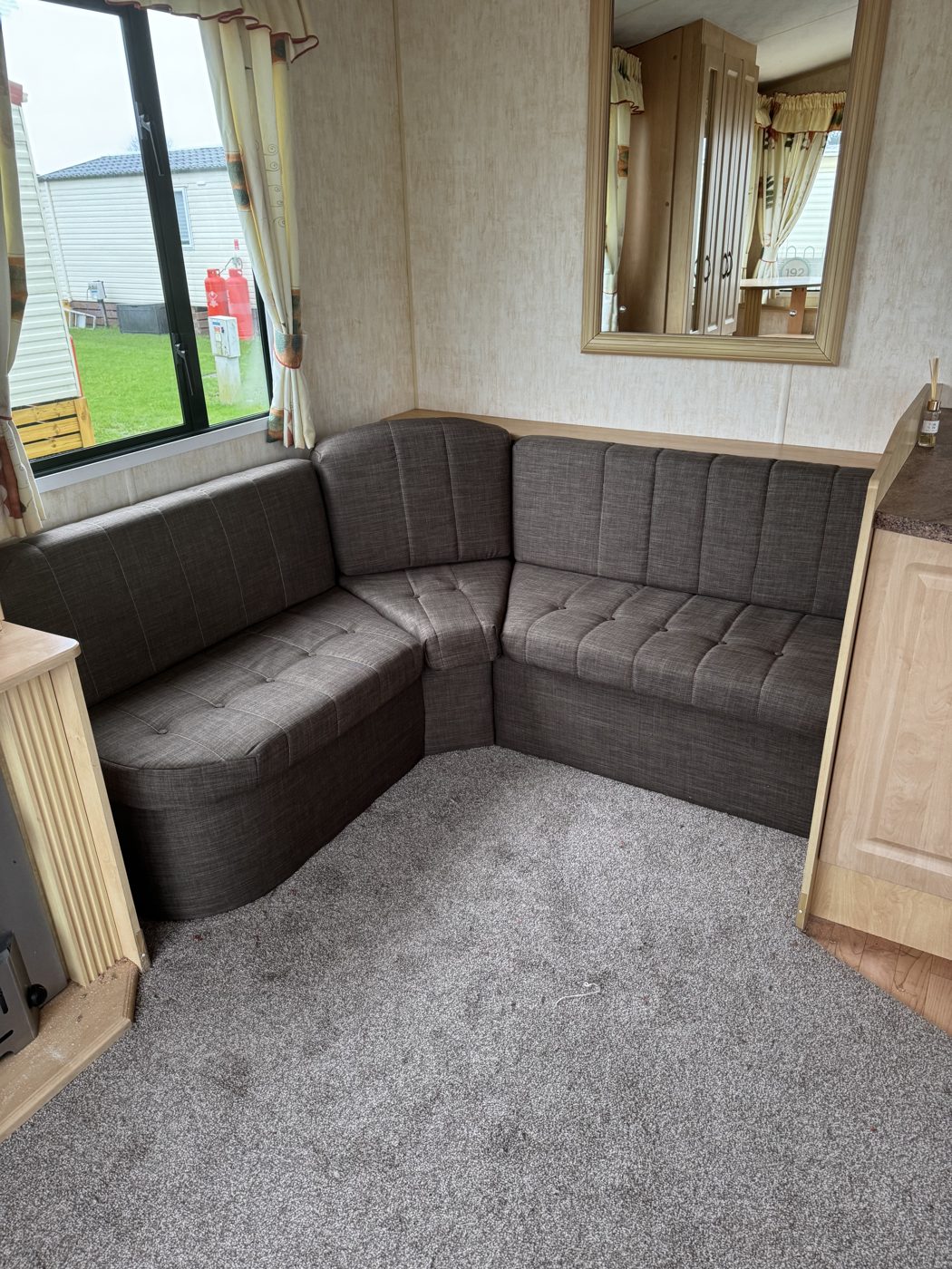 Caravan corner seating re-covered in dark grey hard-wearing fabric