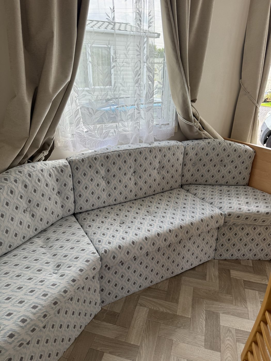 Curved caravan seating re-upholstered in patterned fabric, Fylde coast