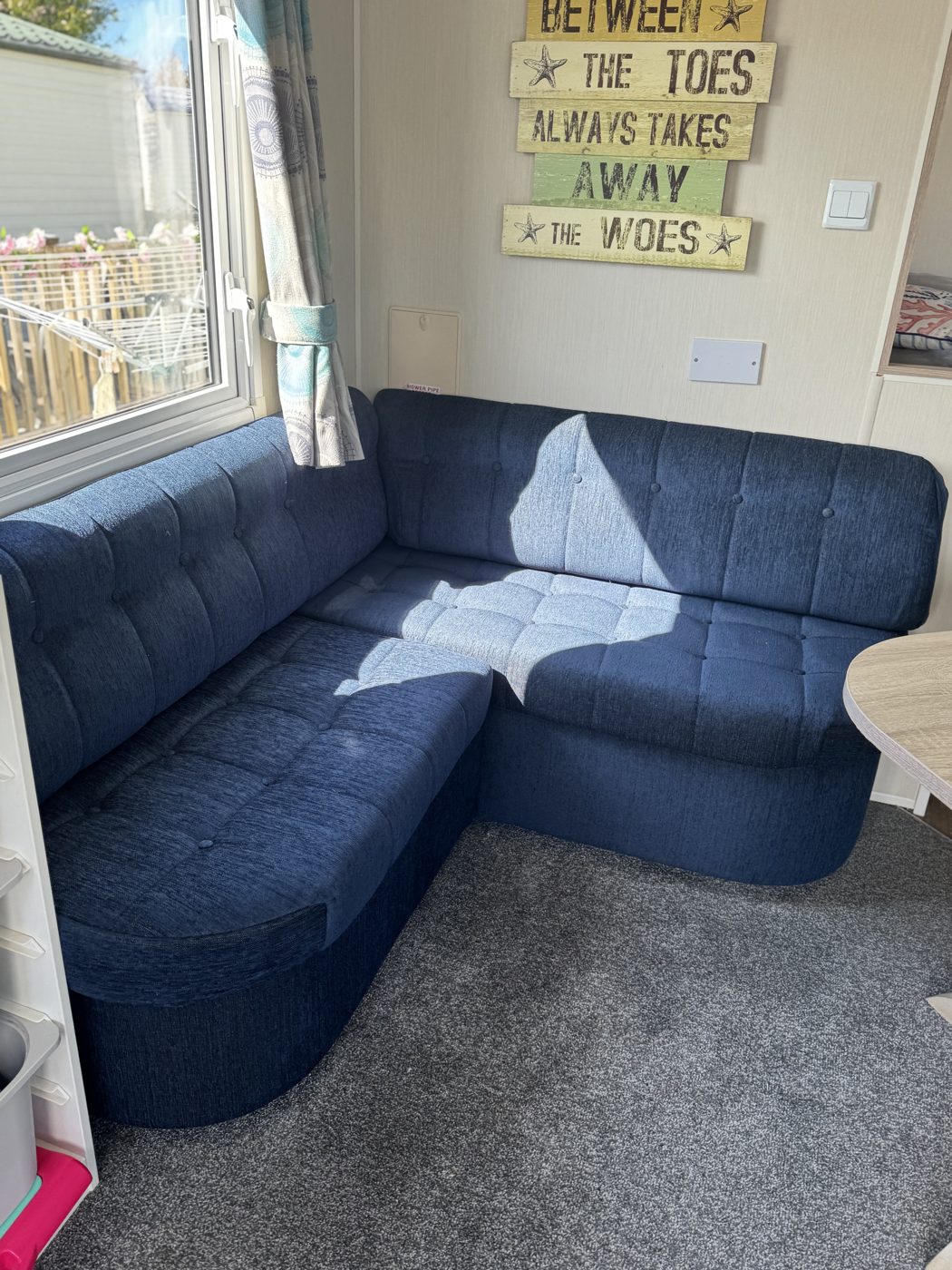 Corner sofa re-foamed and re-covered in navy fabric