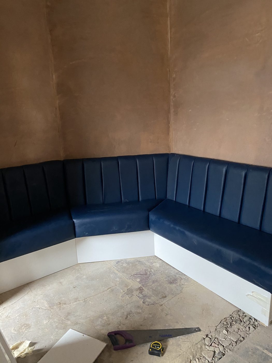 Bespoke fluted booth seating installation in progress, Lancashire