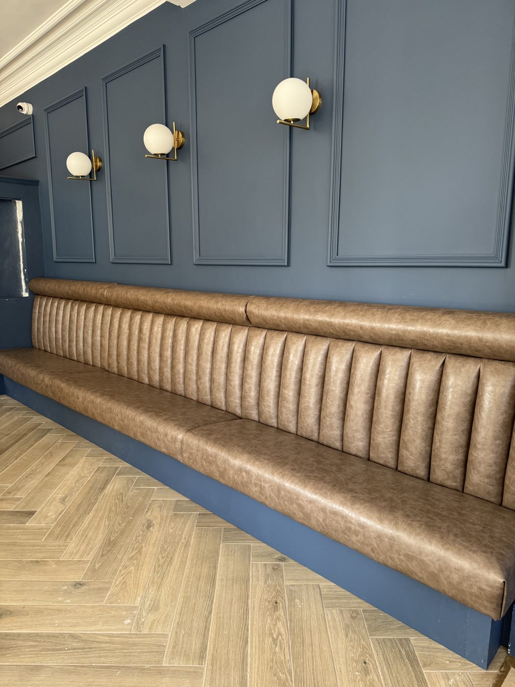 Fluted leather banquette bar seating manufactured and installed in Lancashire