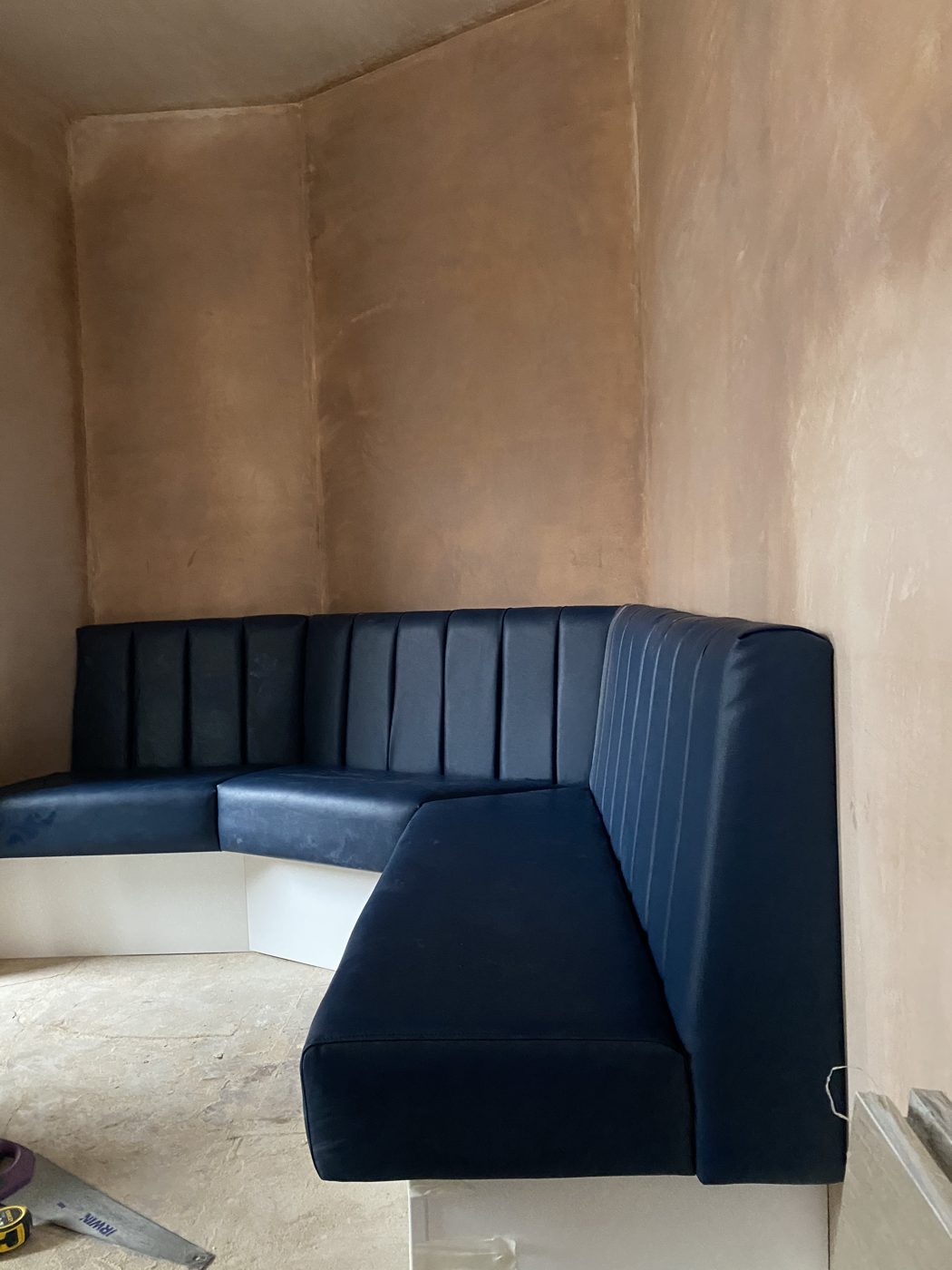 Navy fluted high-back booth seating built and installed