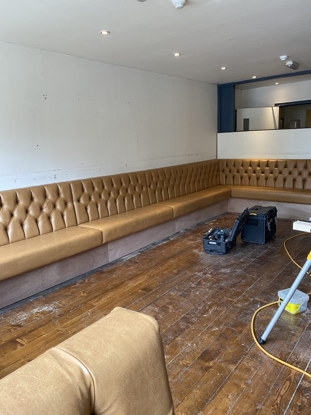 Pub bench seating stripped and rebuilt during refurbishment