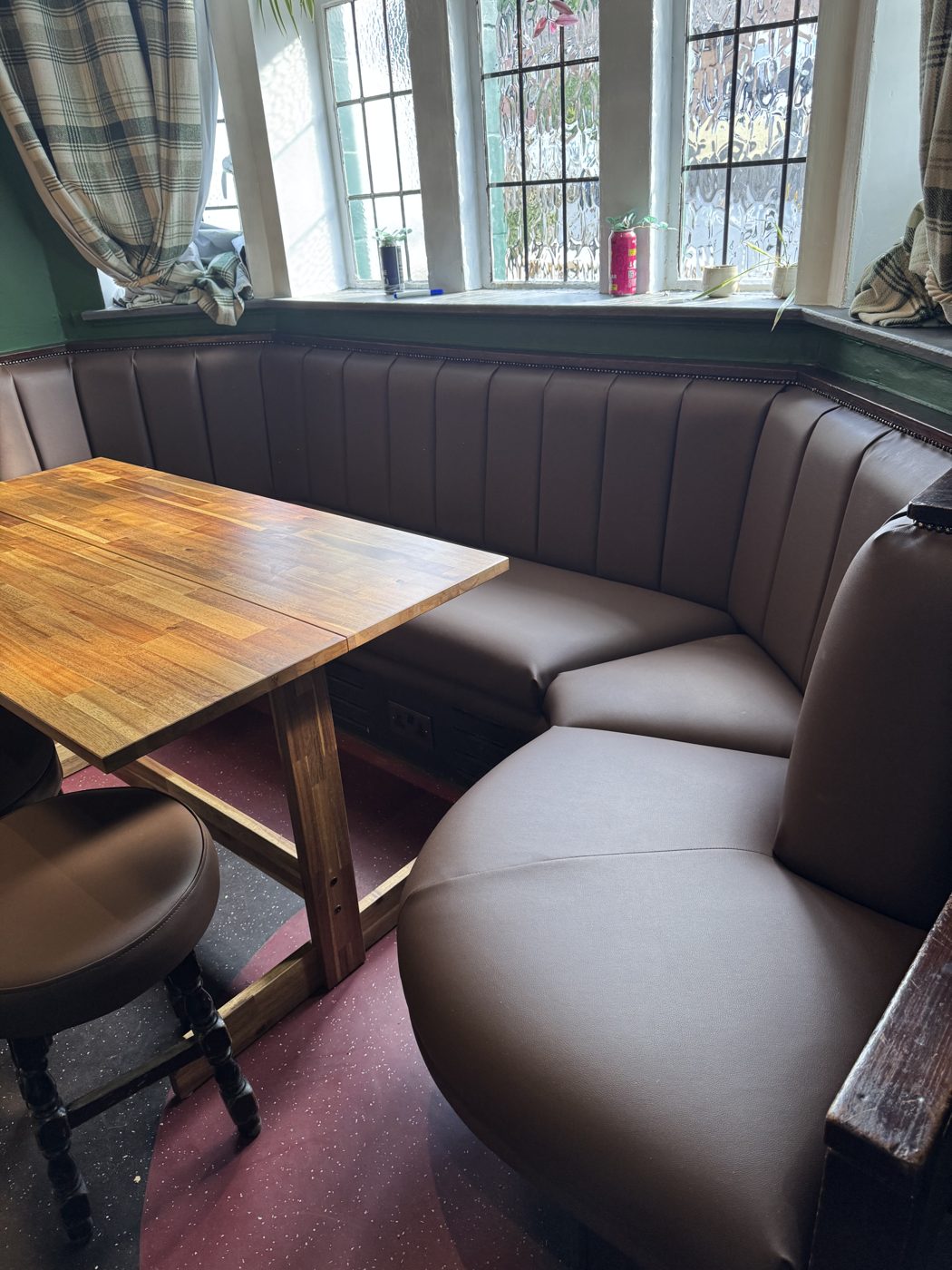 Pub corner booth seating in brown leather with fluted backs, Lancashire